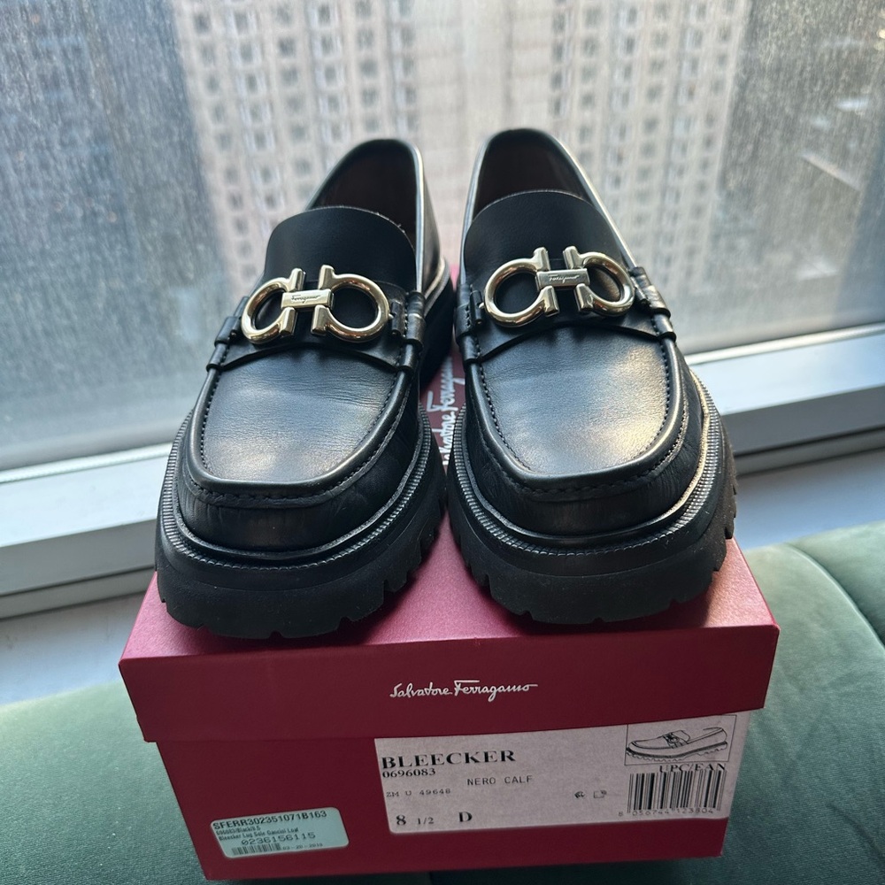Salvatore Ferragamo Black Loafers with Gold Accents